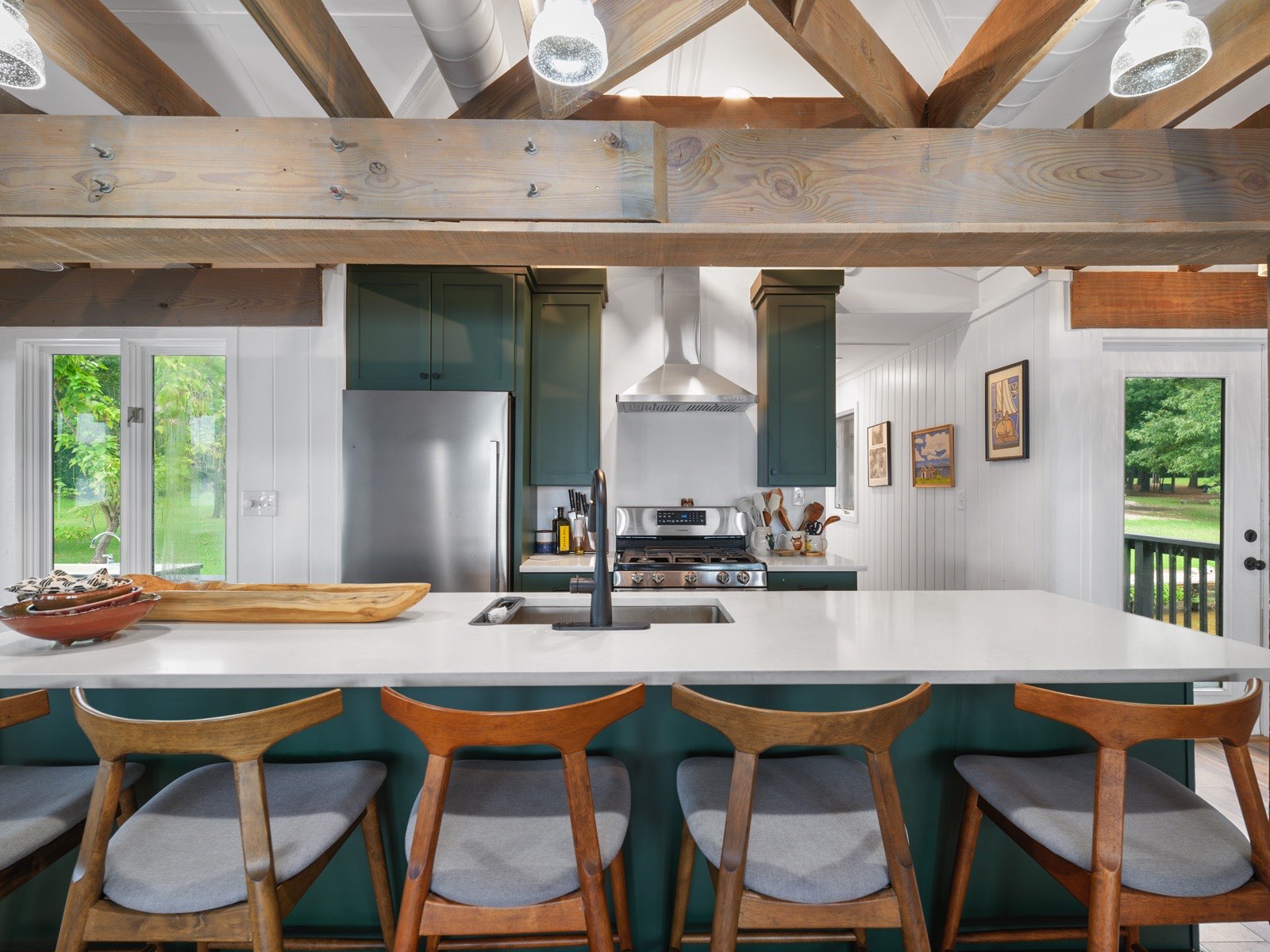 Finished kitchen remodel with timber beams by Q&A Construction